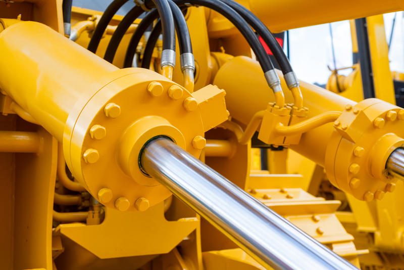 dreamstime_s_142928353 Close up of hydraulic equipment with multiple hoses